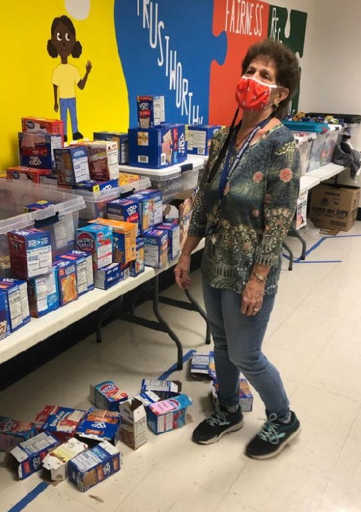 Mrs. Hupfer standing with poptart boxes