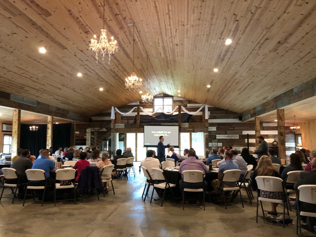 Sleepy Creek Winery. Administrators listening to speaker Tim Clue